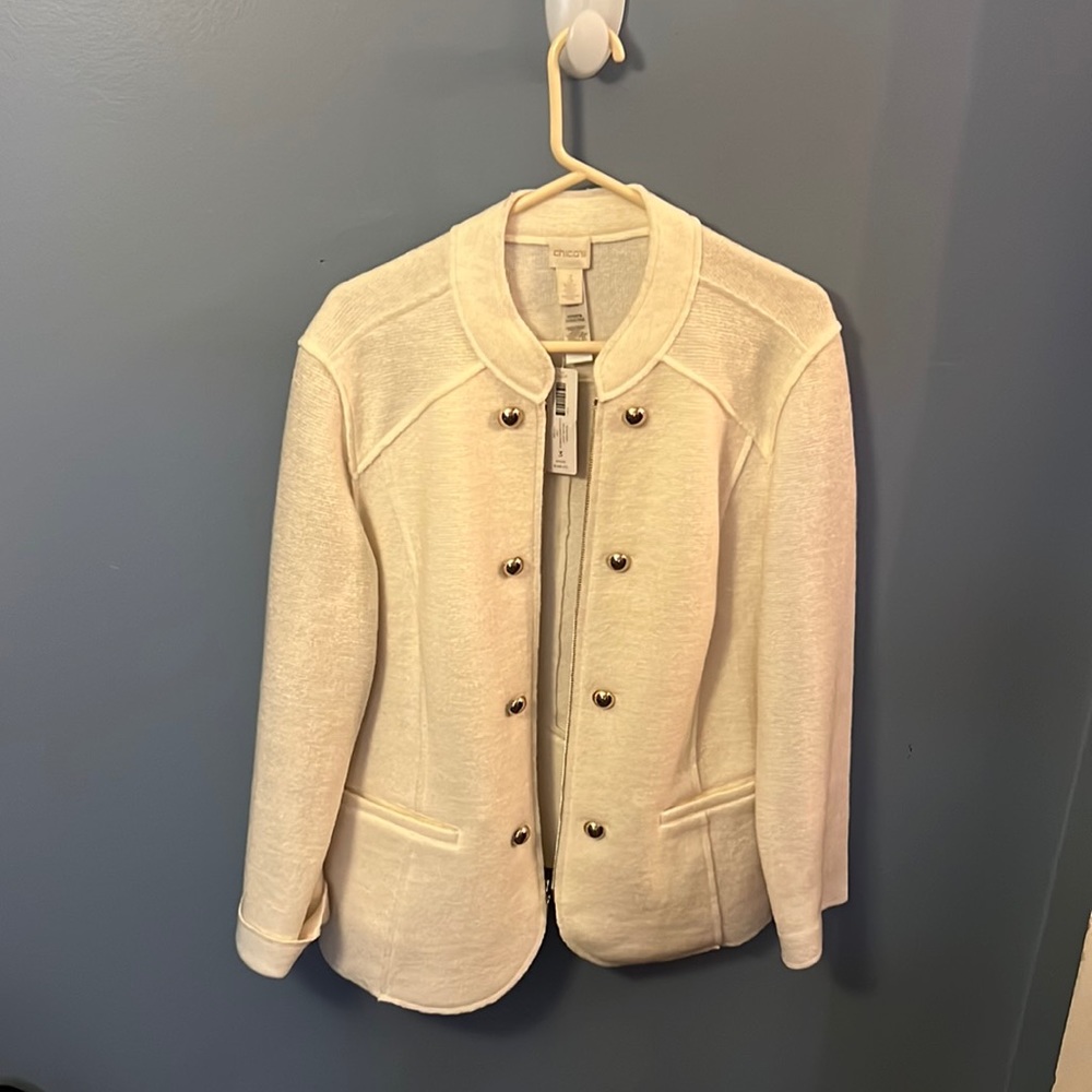 This is a whit never worn out wool Chico’s military jacket